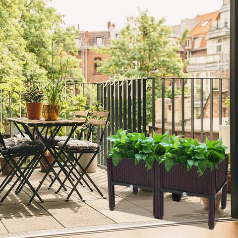Raised Garden Beds Planter Box Set Of 2 With Self Watering Design Plastic Planter for outdoor use on a balcony with plants