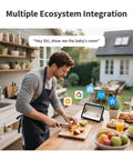 Person in kitchen using tablet with ecosystem icons for '2K Indoor Outdoor Security Camera With Spotlight Color Night Vision And AI Detection 140 Degree Field Of View Two Way Audio Wi Fi 6 HomeKit Secure Video Works With Alexa Google And IFTTT'