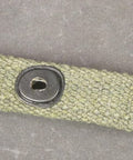 Close-up of M1 Carbine Web Sling OD Green One Inch Canvas Reproduction With Lift-The-Dot Closure WWII Style Steel Fixtures