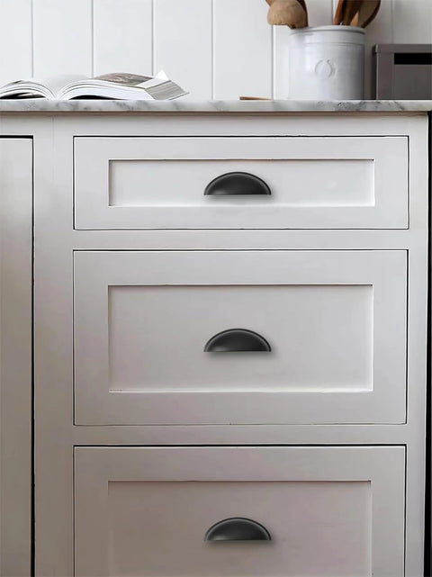 Matte Black Cabinet Cup Pulls Two And A Half Inch Center To Center Pack Of 10 installed on white kitchen drawers