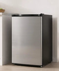 Compact 3.0 Cubic Foot Upright Freezer With Seven Adjustable Temperature Controls And A Sleek Silver Design in a modern kitchen.