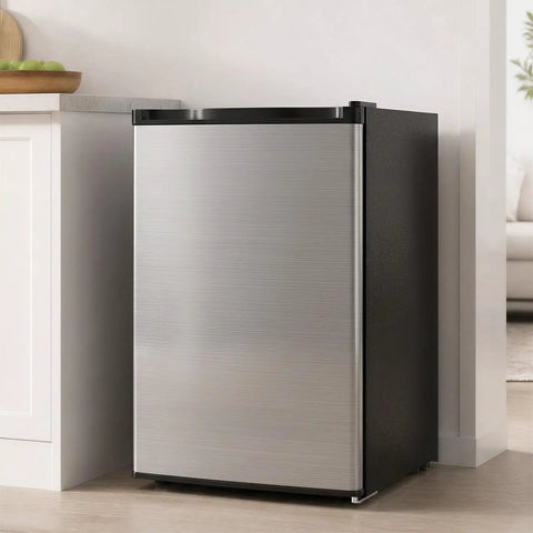 Compact 3.0 Cubic Foot Upright Freezer With Seven Adjustable Temperature Controls And A Sleek Silver Design in a modern kitchen.
