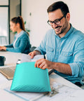 Man using teal bubble mailers 10.5x16 inch self seal padded envelopes waterproof 40 pack usable 10.5x15 size for shipping