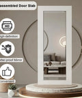 36 By 80 Inch Sliding Barn Door Featuring Concealed Hardware And Butter Smooth Soft Close System Plus Full Length Mirror displayed in a modern living space.