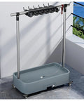 Heavy Duty Floor Mounted Mop Rack And Broom Holder With Stainless Steel Frame And Thick ABS Tray in modern interior setting