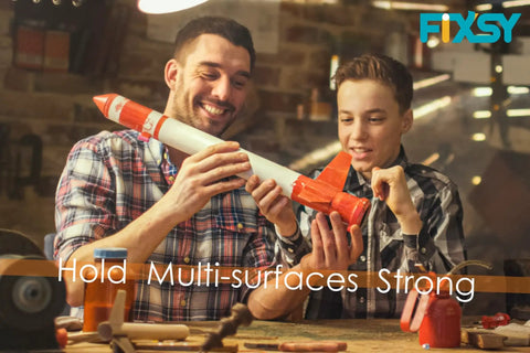 Men assembling a model rocket using Woodworking Glue Sticks 10 Inch Long Diameter Eleven Millimeter Multi Temperature For Most Full Size Glue Guns Pro Grade 5 Pound Box With About 90 Sticks Delivers Strong Bond For Woodworking Crafting Sealing And DIY Projects.