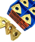 Heavy Duty Indexable Carbide Lathe Tool For Steel Turning With NC3030 Coating, gold carbide inserts in blue storage box.