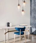 Three Light Teardrop Glass Pendant Chandelier With Hand Blown Seeded Bubbles illuminating modern dining room setup