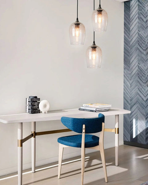 Three Light Teardrop Glass Pendant Chandelier With Hand Blown Seeded Bubbles illuminating modern dining room setup