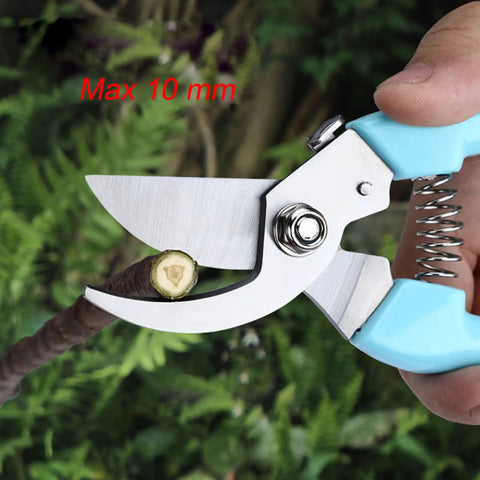 Close-up of Pink Handled Bypass Garden Scissors trimming branch, stainless steel blades, ideal for up to 10 mm branches.