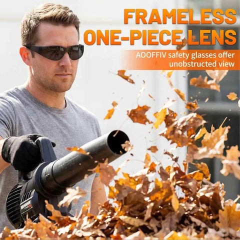 Man using leaf blower wearing frameless one-piece lens safety glasses with unobstructed view, clear safety glasses bulk pack.