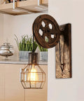 Absolutely Sick Industrial Wall Lamp With Vintage Pulley Handle Crafted From Heavy Wrought Iron Ideal For Barn Lofts And Man Caves With Super Cool Diffused Lighting in a cozy kitchen setting.