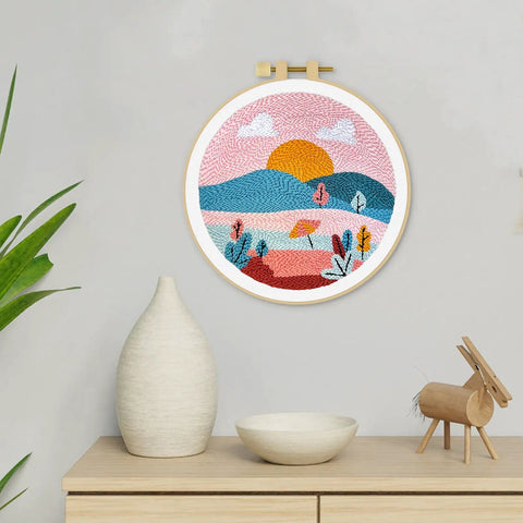 Punch Needle Kit For Adults And Beginners, DIY Landscape Embroidery Set displayed on wall with colorful landscape design