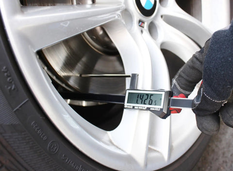 Brake Rotor Gauge With Large Digital Display Caliper For Quick In Wheel Measurements 0 To 3.2 Inch Range in use on vehicle wheel