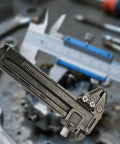 EDC Ready Compact Pocket Vernier Caliper with smooth sliding on blurred workshop background, 0-50 mm zinc alloy tool.
