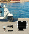 Beefy 800W Brushed Motor Kit For Electric Bikes Scooters Skateboards And Trikes 36V System displayed by a scooter near water