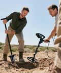 Two men using 46 Inch Metal Detecting Shovel With Double Serrated Blade For Relic Hunting Gold Prospecting Landscaping And Garden Work Built With Manganese Steel Head And Carbon Handle For Rugged Outdoor Use In Rock Sand And Wet Ground in a field.