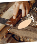 Quality Wood Biscuit Joiner Plates for Sturdy Furniture Assembly shown in use with a hand tool on wooden boards.