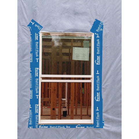 Beefy Butyl Window Flashing Tape 4 Inch By 100 Foot Waterproof Self Adhering Sealant applied to window frame on building site