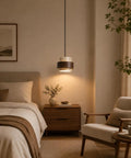 Axamate Wabi Sabi Pendant Light Natural Stone Chandeliers Dia 8" illuminating a bedside table in a cozy bedroom setting.