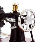 Close-up of Handcrafted Vintage Sewing Machine Music Box With Wind Up Mechanism Matte Ornament, showing gear details