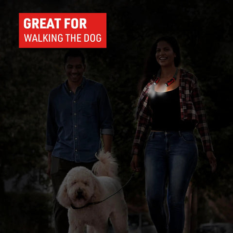 Person wearing Rechargeable Hands Free Neck Light With 9 Hour Run Time, Four Modes, USB Cord Included, Water Resistant, walking dog.