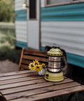 Dusty Yellow Forest Lantern Vintage Rechargeable LED Lantern With Adjustable Brightness on wooden camping table