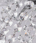 Close-up of K9 clear crystals on Lit Six Light Chrome Crystal Pendant Chandelier Flush Mount Ceiling Light for Dining Room Modern Style.