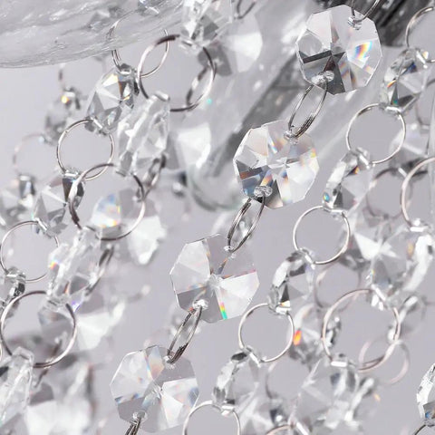 Close-up of K9 clear crystals on Lit Six Light Chrome Crystal Pendant Chandelier Flush Mount Ceiling Light for Dining Room Modern Style.