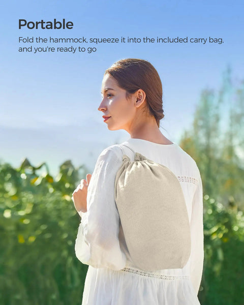 Person carrying a bag for Double Hammock 98.4 X 59.1 Inches With 660 Lb Capacity Breathable Cotton Polyester Fabric Backyard Oasis Lounge