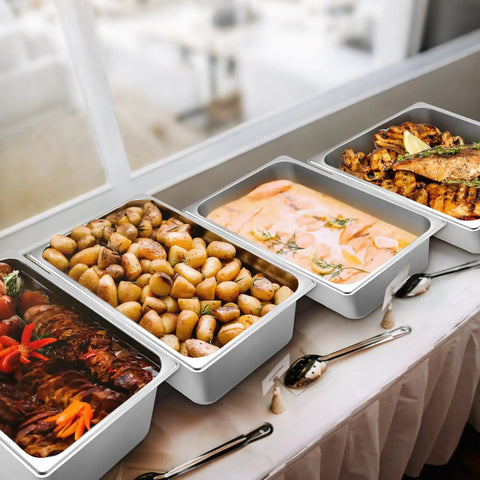 Four Pack Full Size 6 Inch Deep Steam Table Pans Stainless Steel Serving Trays For Food Service Hotels Buffets And Parties Chafing Dishes Catering Supplies filled with various foods on a table.