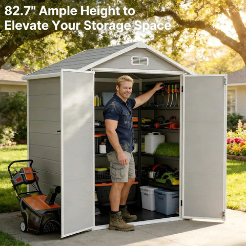 Man standing inside 6x4.4 Ft Resin Outdoor Storage Shed With Floor Lockable Doors And Windows All Weather Plastic Garden Tool Shed