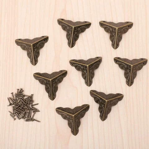 Eight vintage bronze corner protectors and screws from Antique Engraved Latch Hasp Hinges And Box Corner Protectors Hardware Kit