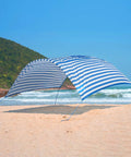 Wind-Powered Beach Shade Canopy No-Fuss Easy Setup Sun Shelter Tent with UPF 50+ UV Protection on sandy beach