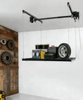 Hardcore Adjustable Overhead Garage Storage Rack With 300 Pound Capacity rustproof carbon steel ceiling mount hanger displaying tools and gear.