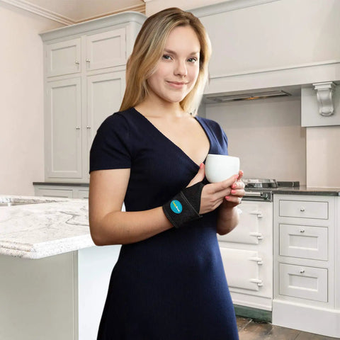Woman wearing All Day Comfort Wrist Wrap For Carpal Tunnel And Arthritis Relief, Adjustable Fitted Brace That Fits Both Hands, One Size
