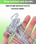 Hand holding pack of 50 landscape staples with pick hook 6 inch galvanized garden pins for weed fabric lawn tent yard and sod