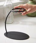 Heavy Duty Coffee Filter Holder Funnel Stand With Slick Black Iron Base For Hands Free Drip Pour Over Brewing, hand adjusting the stand.