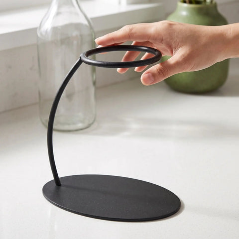 Heavy Duty Coffee Filter Holder Funnel Stand With Slick Black Iron Base For Hands Free Drip Pour Over Brewing, hand adjusting the stand.