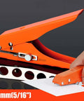 Beefy Five Sixteenth Inch Heavy Duty Single Hole Puncher in orange, demonstrating punching 5/16 inch holes in paper, with clear scale visible.