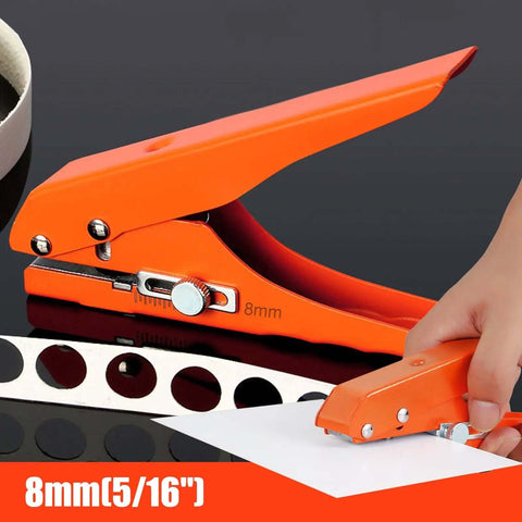 Beefy Five Sixteenth Inch Heavy Duty Single Hole Puncher in orange, demonstrating punching 5/16 inch holes in paper, with clear scale visible.