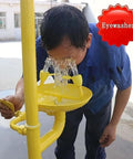 Person using Must Have Emergency Eye Wash And Shower Station For Lab Safety with dual spray eyewasher and push plate.