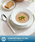 20 Piece Silverware Set For Four Built From Food Grade Stainless Steel Flatware with soup spoon, placed next to soup bowl on table.
