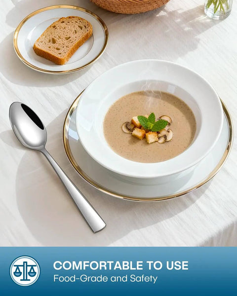 20 Piece Silverware Set For Four Built From Food Grade Stainless Steel Flatware with soup spoon, placed next to soup bowl on table.