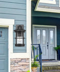 Outdoor Wall Sconces Dusk To Dawn Black Finish Seeded Glass Exterior Wall Mount Lighting 2 Pack shown by entrance door