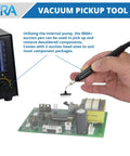 Hand using 4 In 1 SMD Hot Air Rework Station vacuum pickup tool to lift IC component from circuit board.