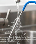 Washing upgraded 2 pack meat probes for pellet grills with 3.5mm plug under faucet for cleanliness.