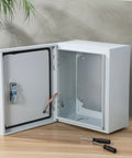 Open Outdoor Waterproof Stainless Steel Electrical Junction Box 250x300x140mm on a table, showing interior compartments.