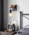 Dimmable Edison Style Black Wall Sconce With On Off Dimmer Switch, showcasing vintage charm in a bedroom setting on wood panel