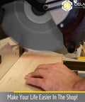 Delmar Tools miter saw with bright red laser guide projecting line onto wood for precise cuts.